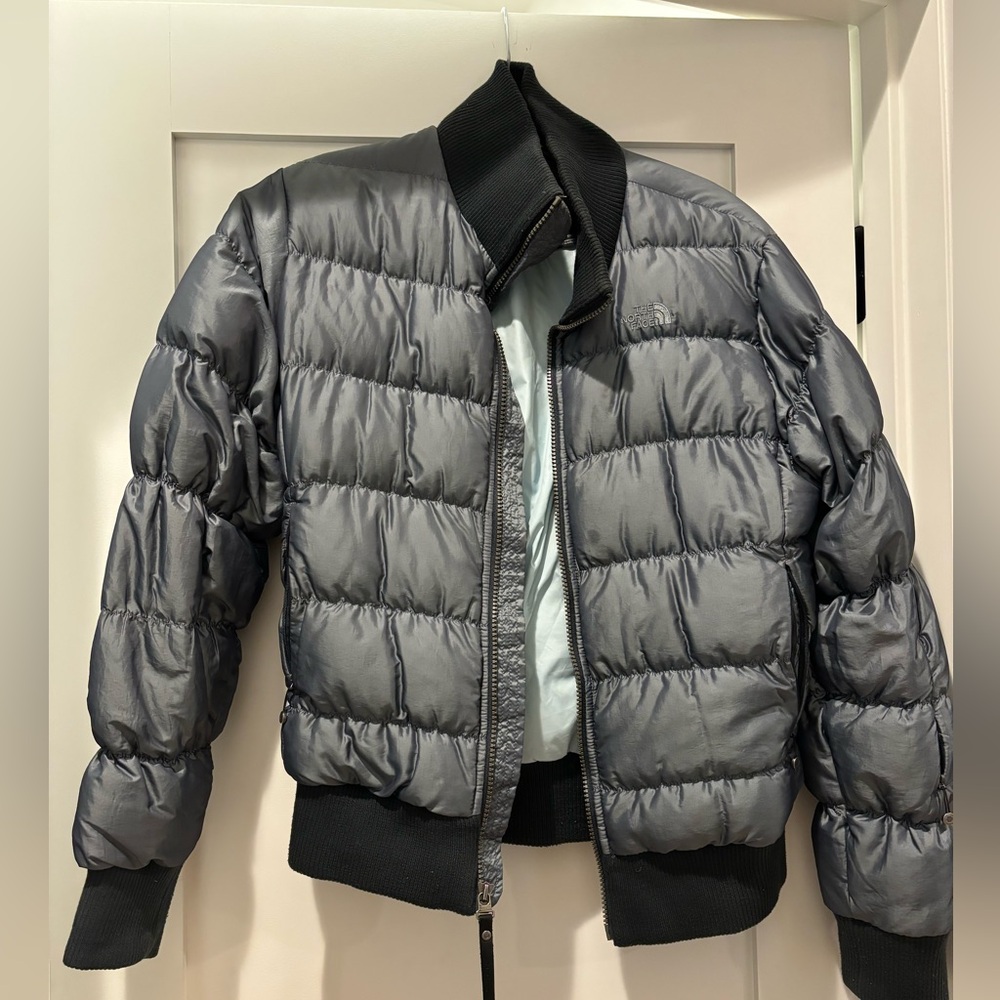 The North face women’s bomber jacket size medium. Color is a blue/silver.